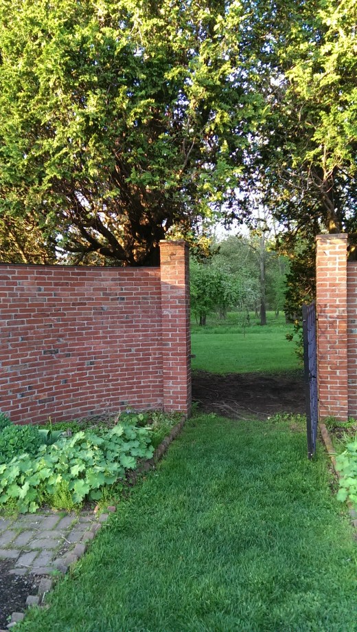 open gate in brick wall at Stevens Coolidge Place
